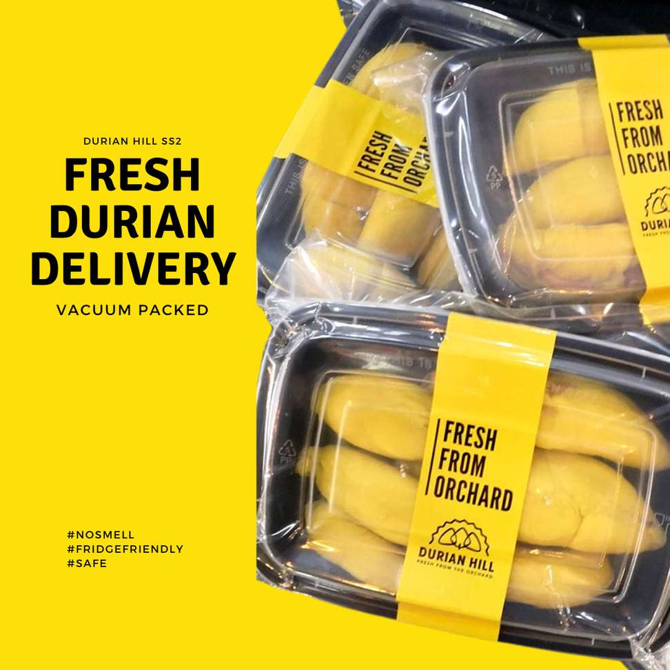 durians served in plastic boxes with a label