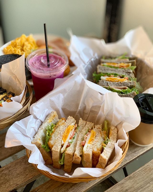 toast, sandwiches and a purple coloured drink