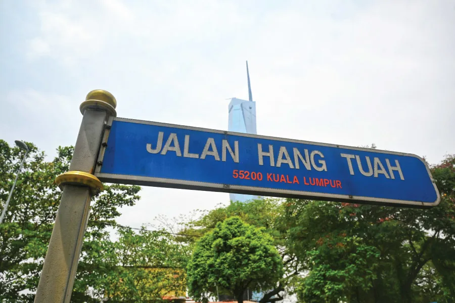 a blue road signage that states Jalan Hang Tuah in Kuala Lumpur