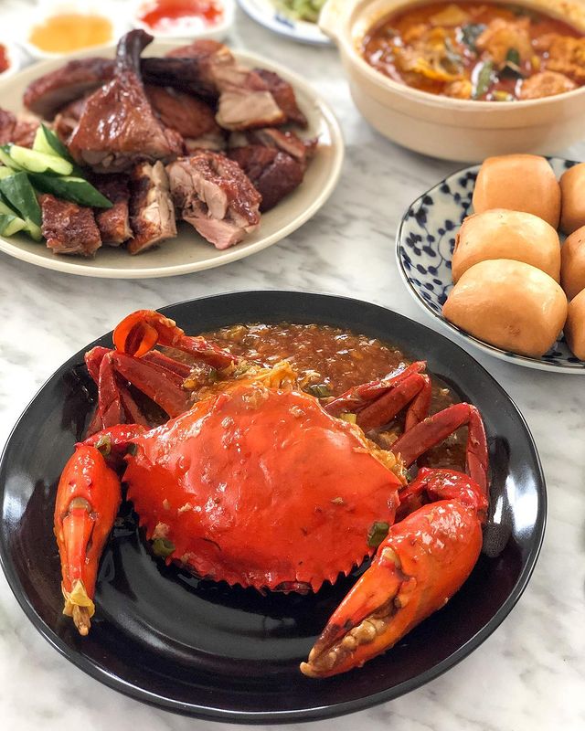 crabs and other dishes served on a plate