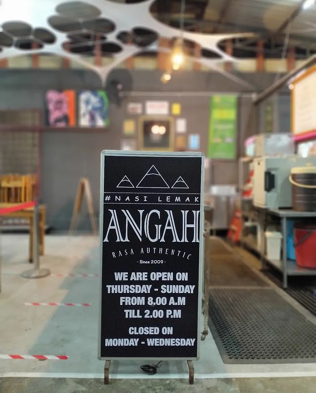 standing signage showing a local nasi lemak stall