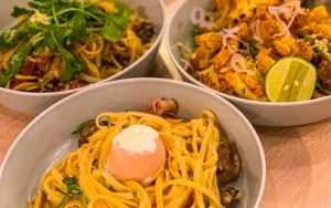 Three plates of different pastas