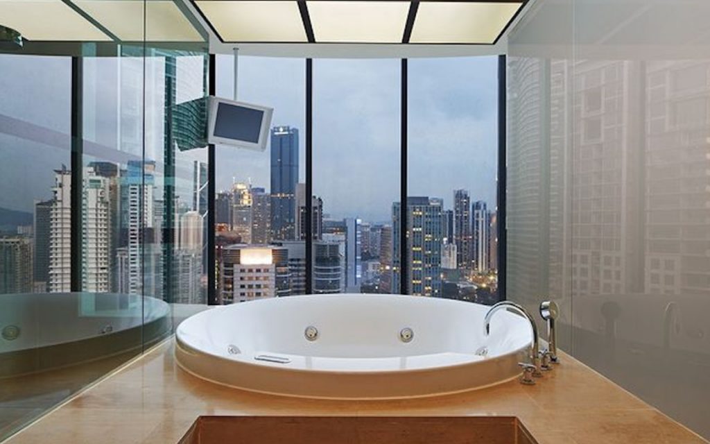bath tub in a hotel with a good city view