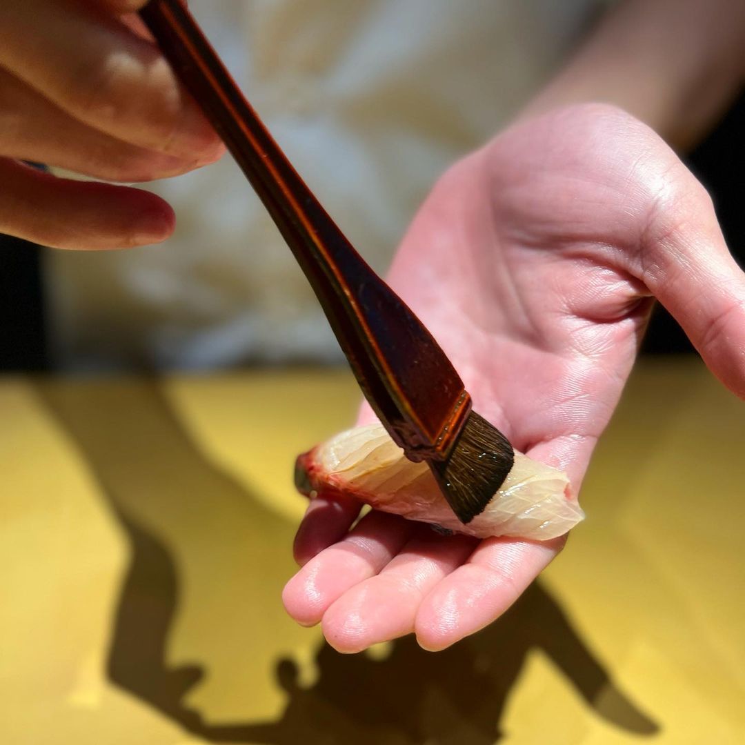 a man making a sushi