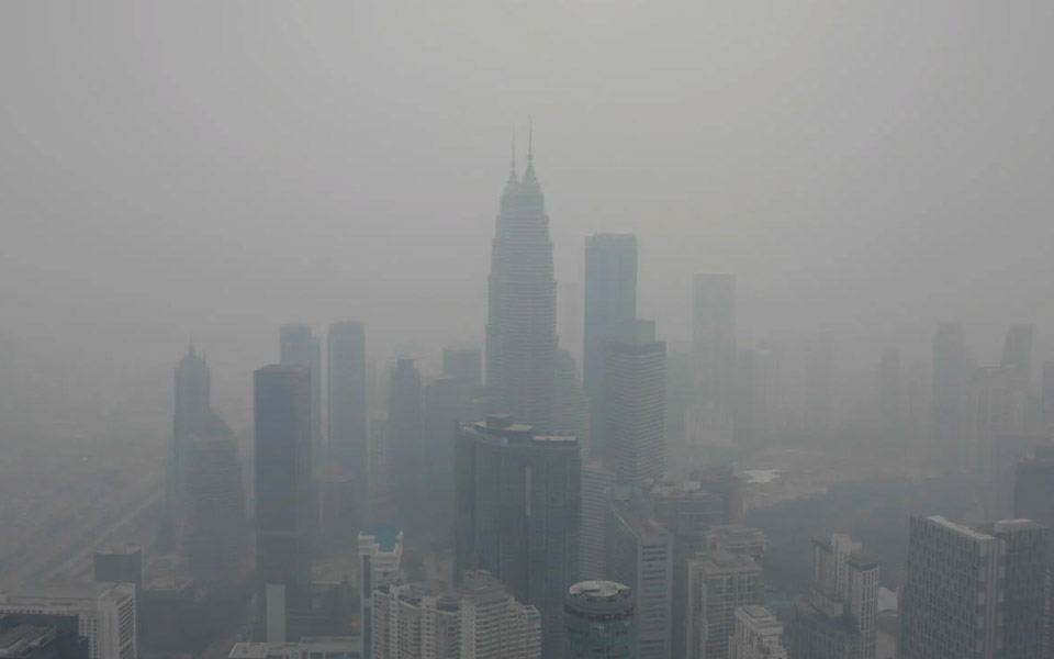 haze covering a city with skyscrapers