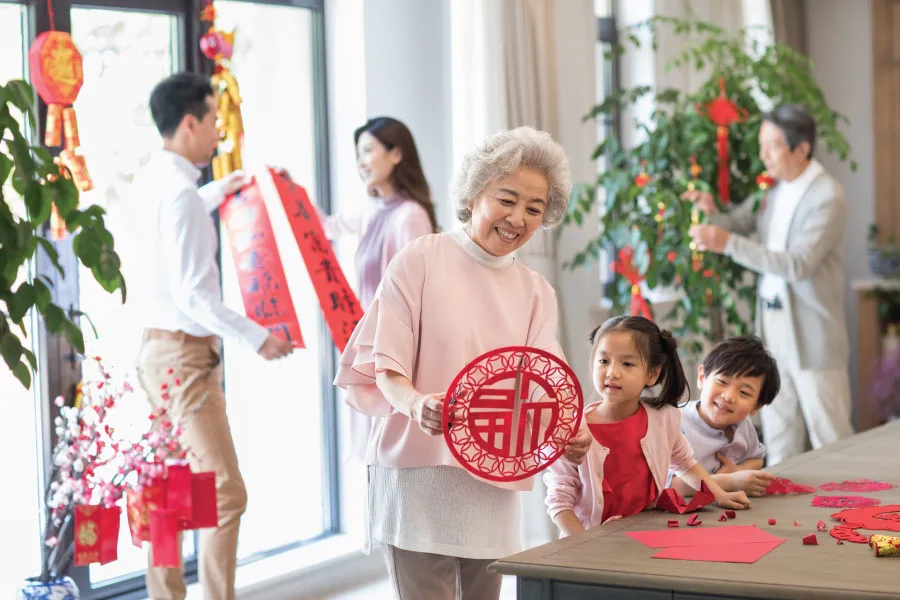different members of the family getting ready for Chinese New Year