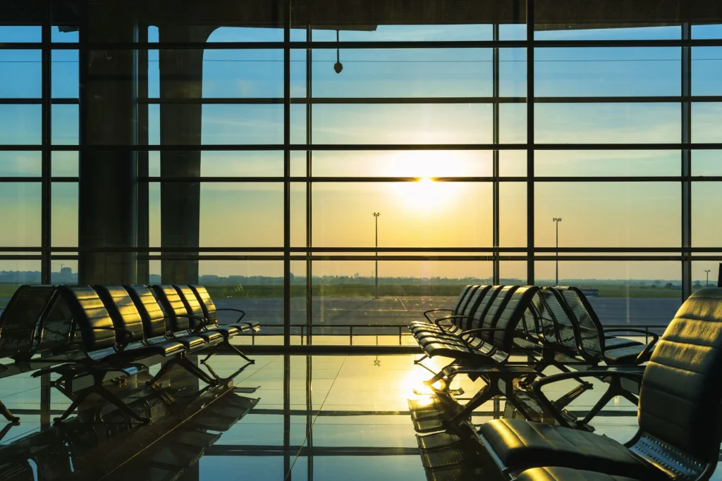 the hall of the airport with natural sunset lights flowing in from the glass walls