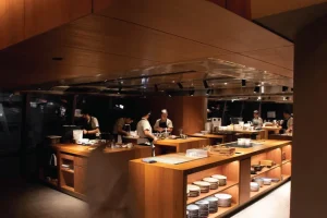 chefs working in an open kitchen restaurant