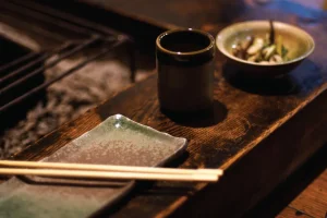 plate, chopsticks and bowl set on a table