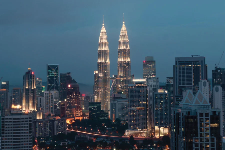 night view of a city skyline with a twin towers