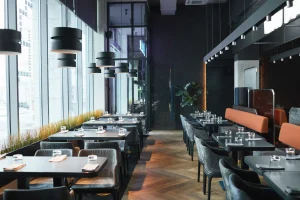 rows of tables and chairs in a restaurant