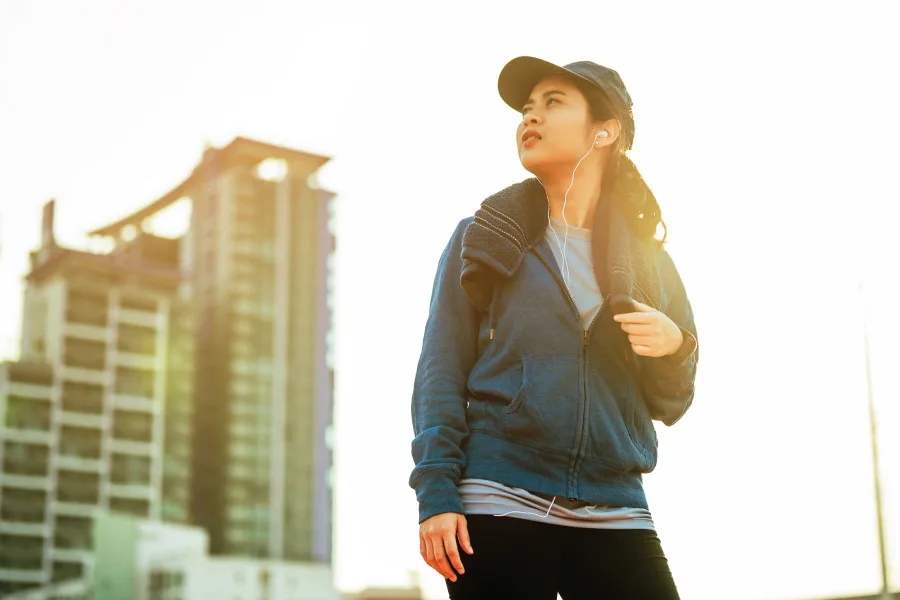 young woman with workout attire in an urban city