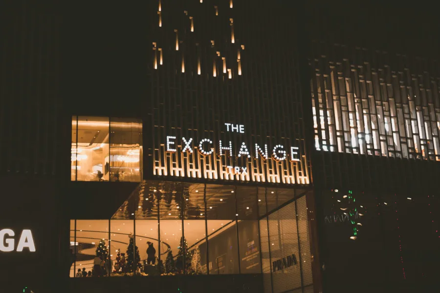 facade of a building with lights and The Exchange TRX signage