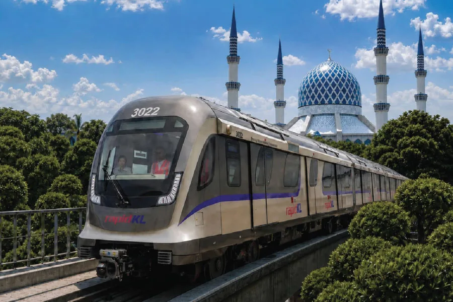 a train passing by a mosque