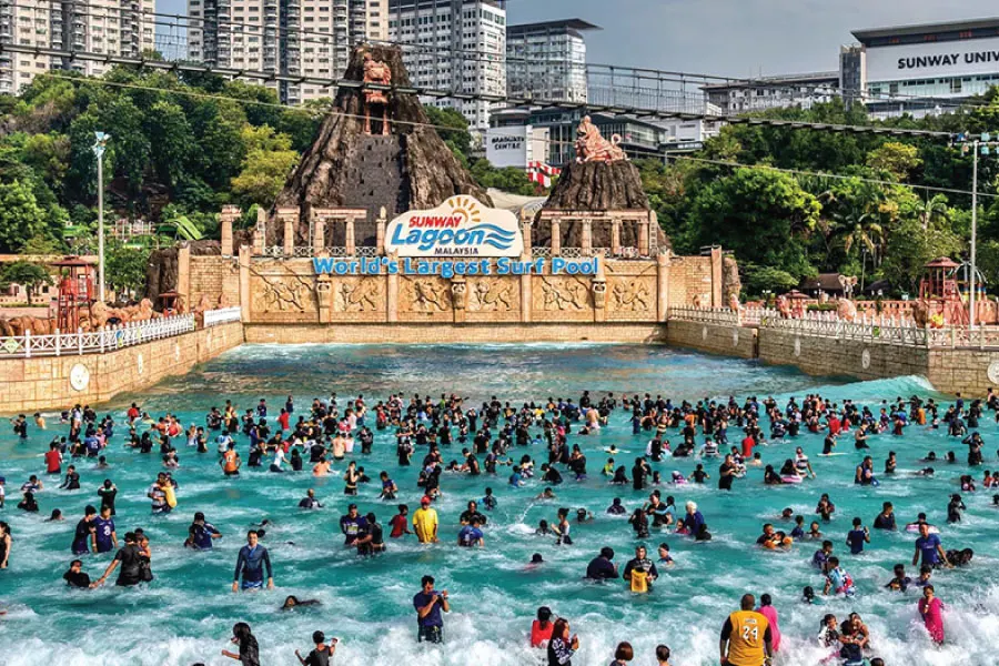 crowds dipping in a man made lagoon theme park