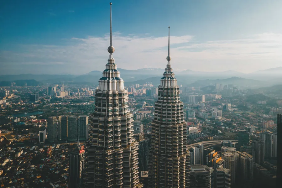drone shot with a bird's eye view of Petronas Twin Towers Kuala Lumpur