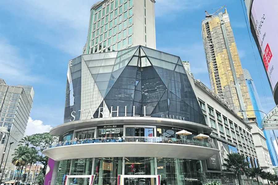 a modern building with a signage, Starhill